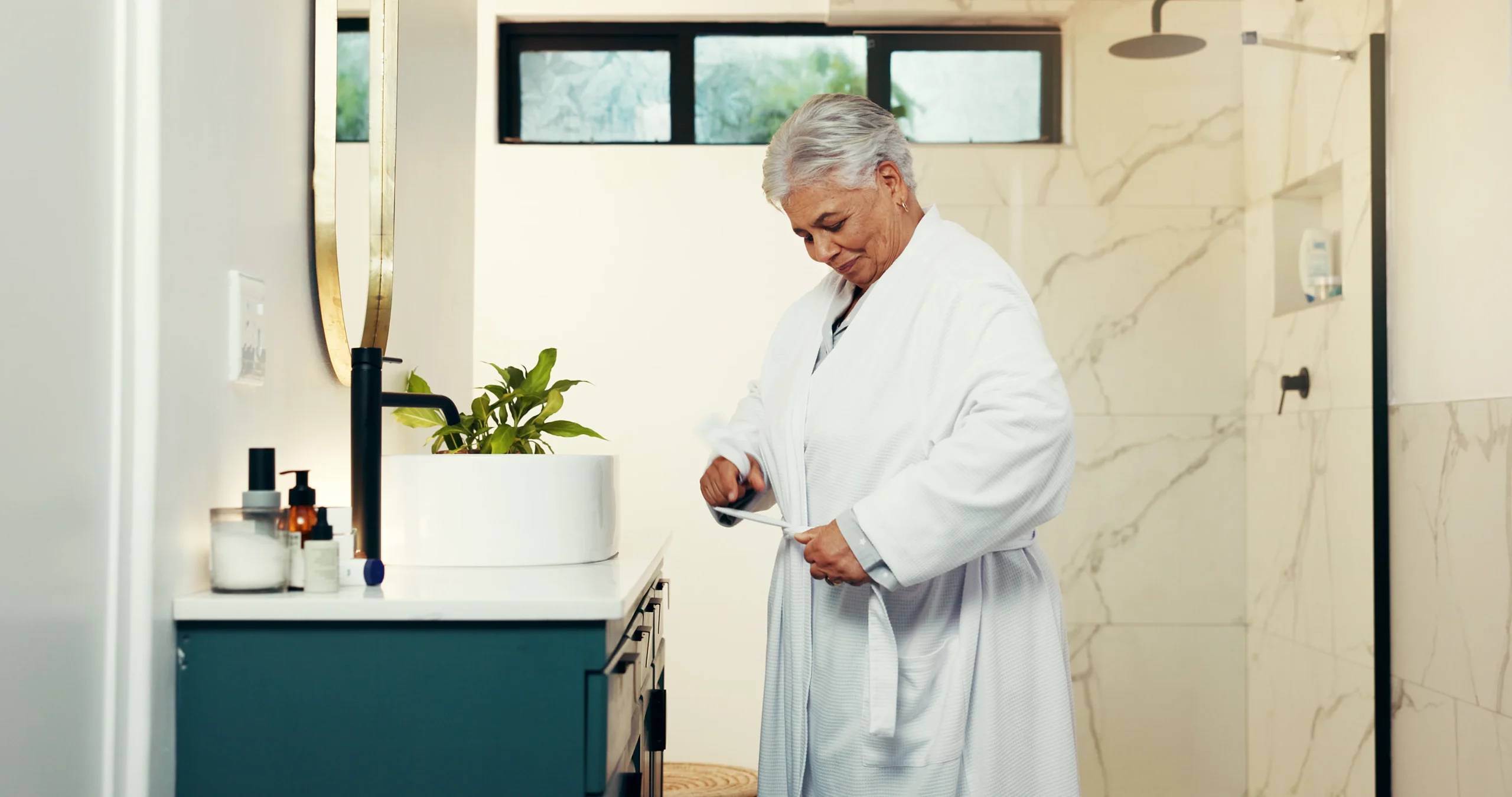 Senior woman getting ready for walk-in bath